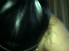 Mature mommy gives a blowjob to a masked man with a big cock