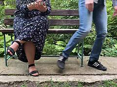 Mature woman receives a public blowjob in the park