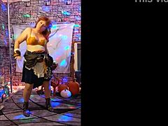 Hot MILF in a redheaded cosplay performs a sensual striptease on Halloween